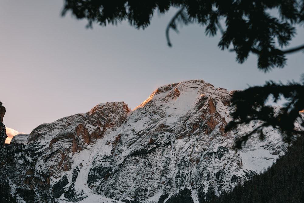 snow covered mountain under white ssky during daytime