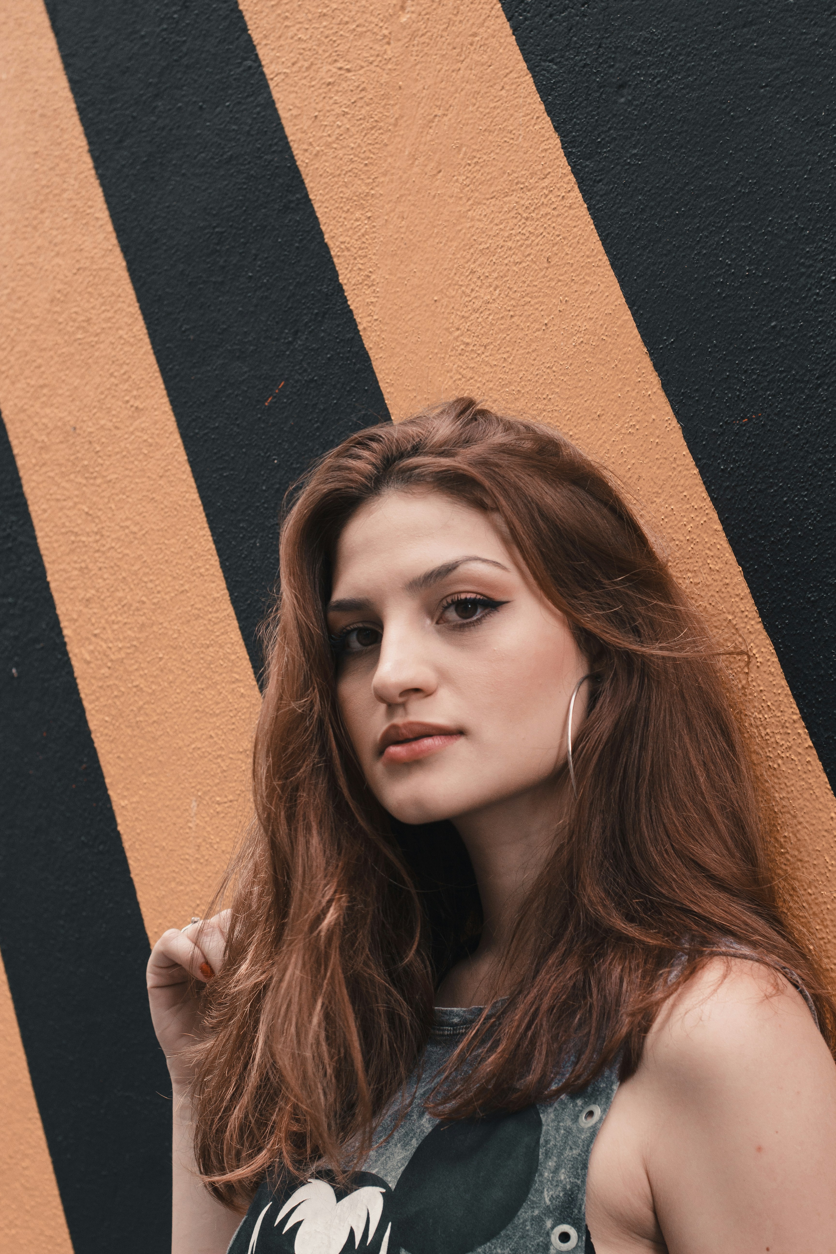 woman leaning on wall