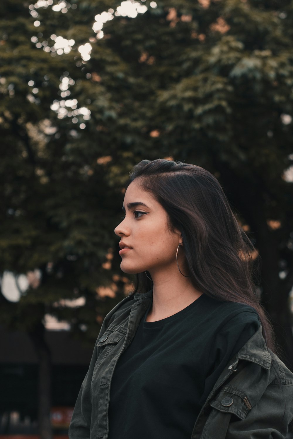 selective focus photography of woman wearing gray jacket