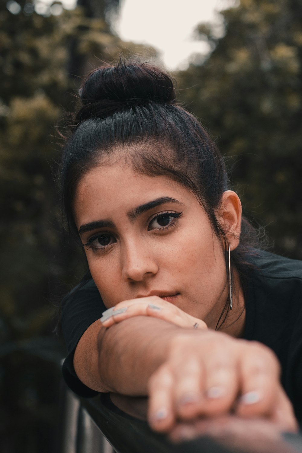 girl wearing hoop earring close-up photo