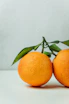 two orange fruits on table