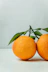 two orange fruits on table