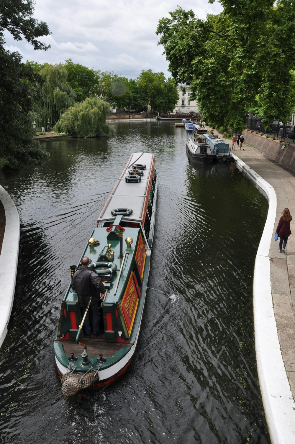 gray and green ship on calm water