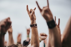 sign of the horns close up photography