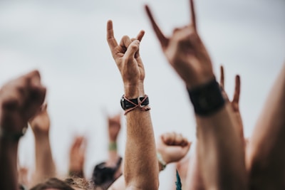 sign of the horns close up photography