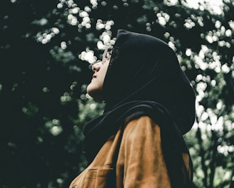woman in black hijab headdress during daytime