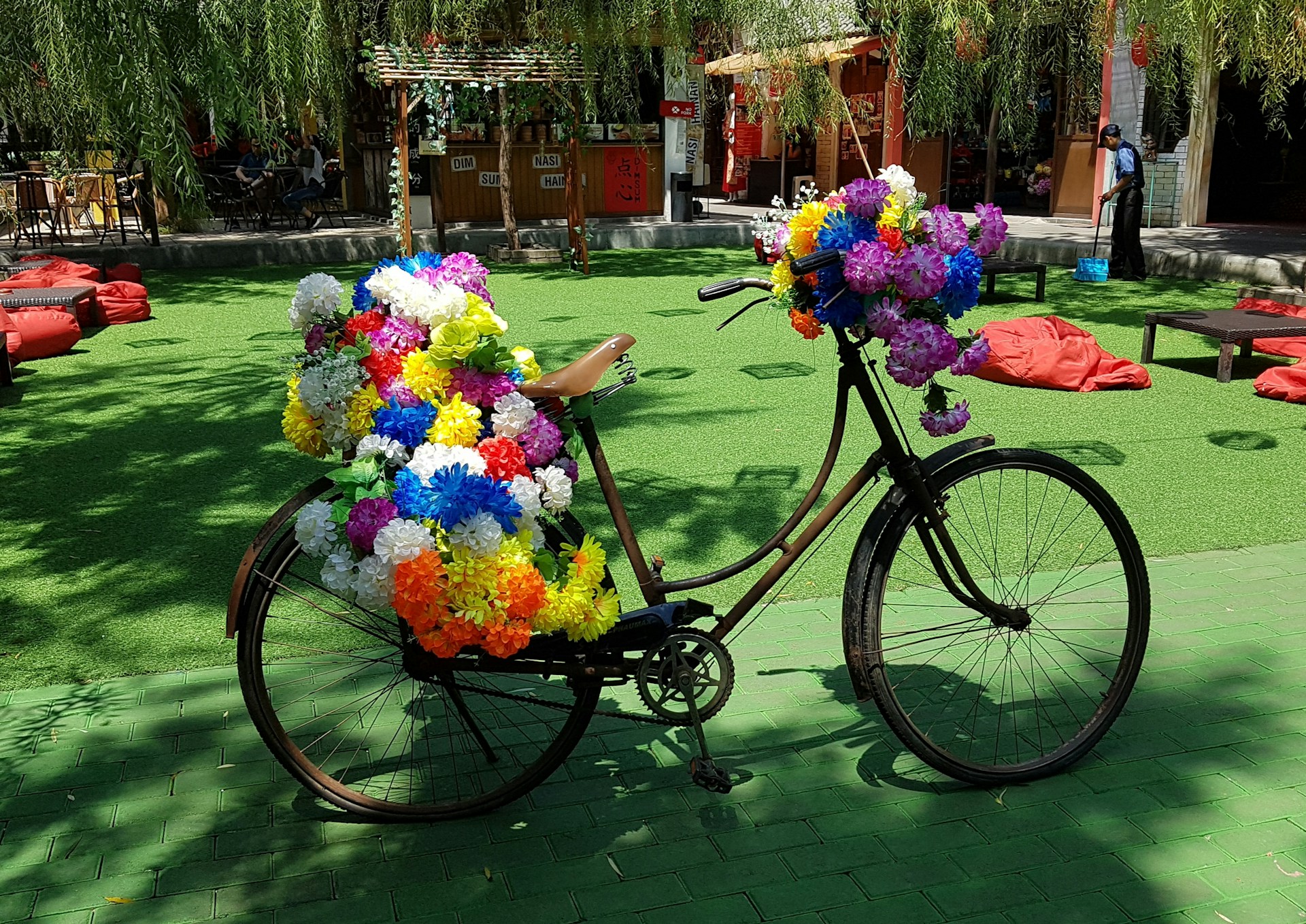 woman wearing yellow long-sleeved dress under white clouds and blue sky during daytime