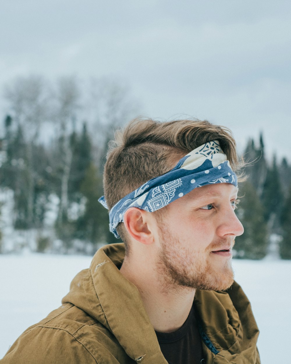 man with blue and white headband