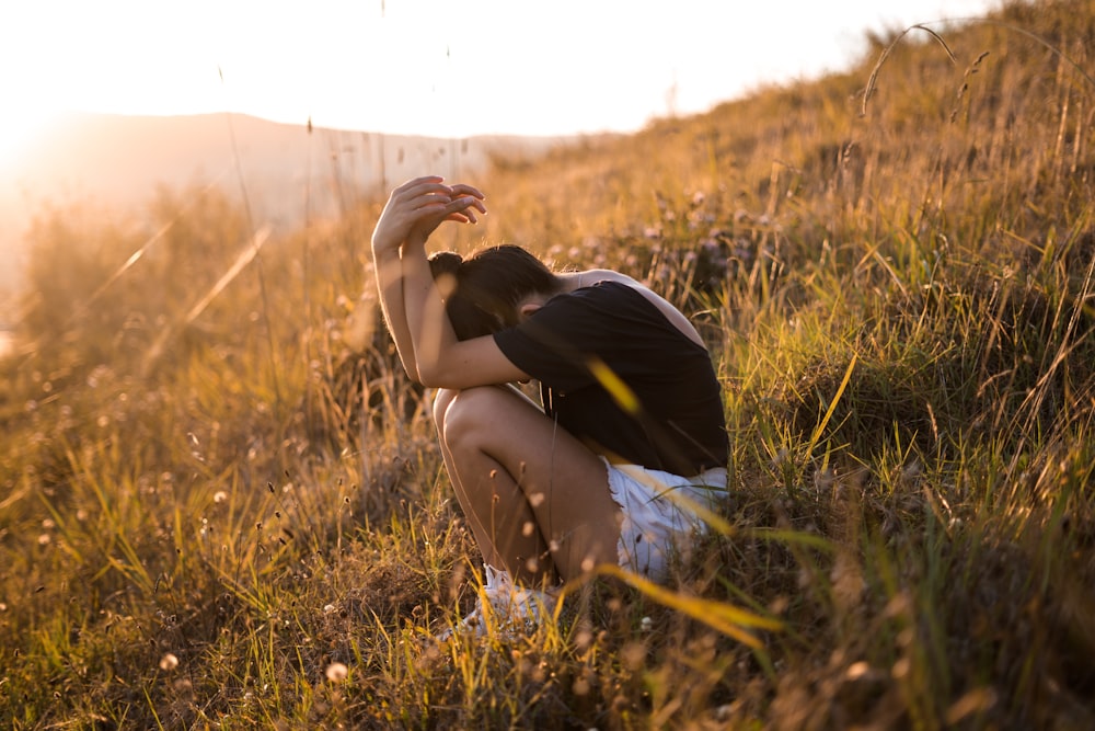 woman sitting on ground