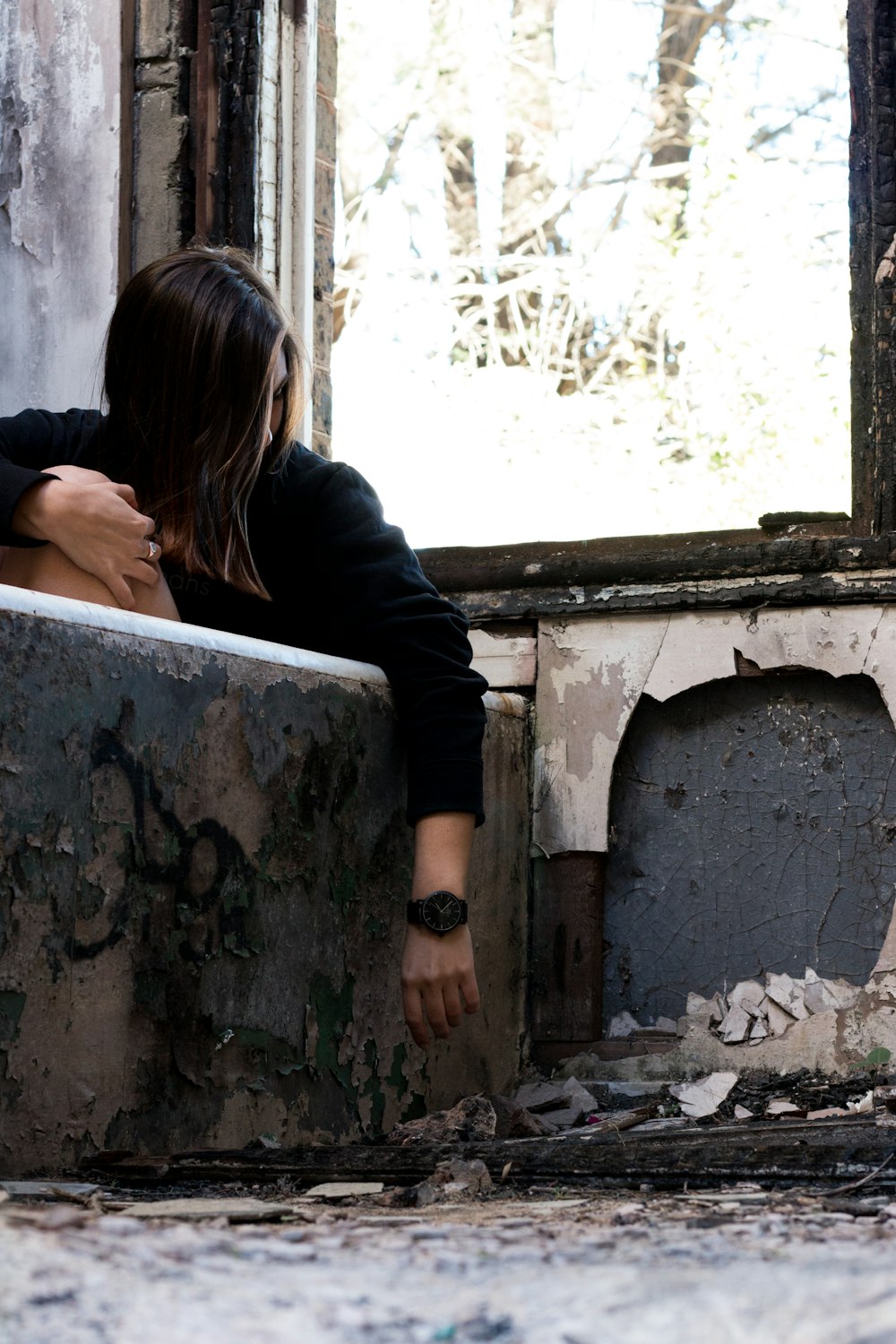 woman wearing black shirt near window