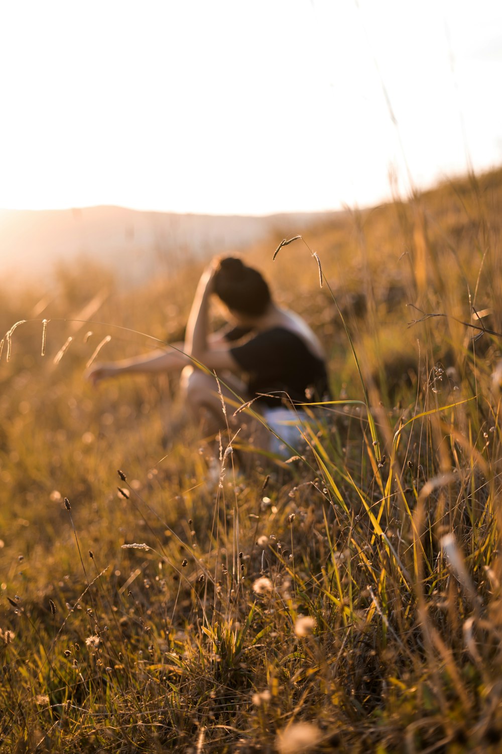 woman sitting on grass