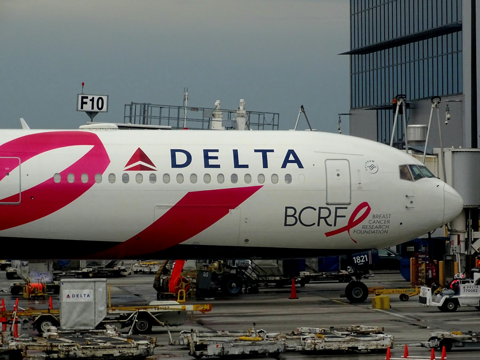 woman wearing yellow long-sleeved dress under white clouds and blue sky during daytime
