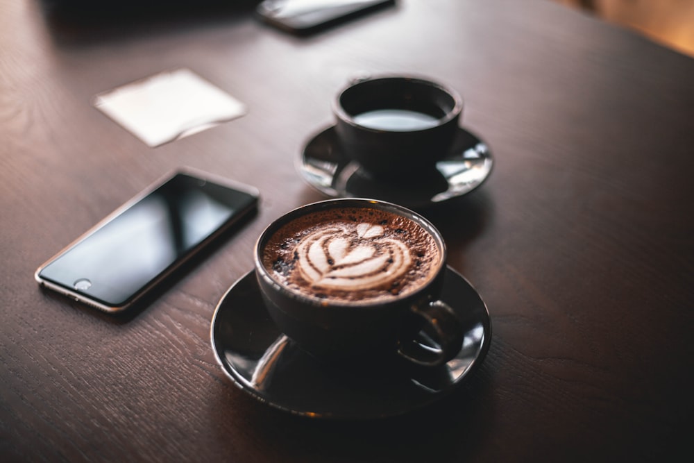 black ceramic cup with saucer