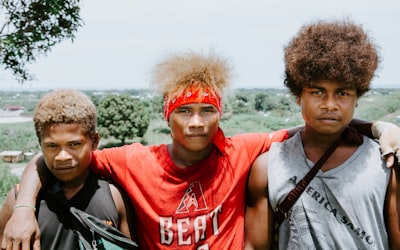 three boy standing outdoor close-up photography solomon islands google meet background