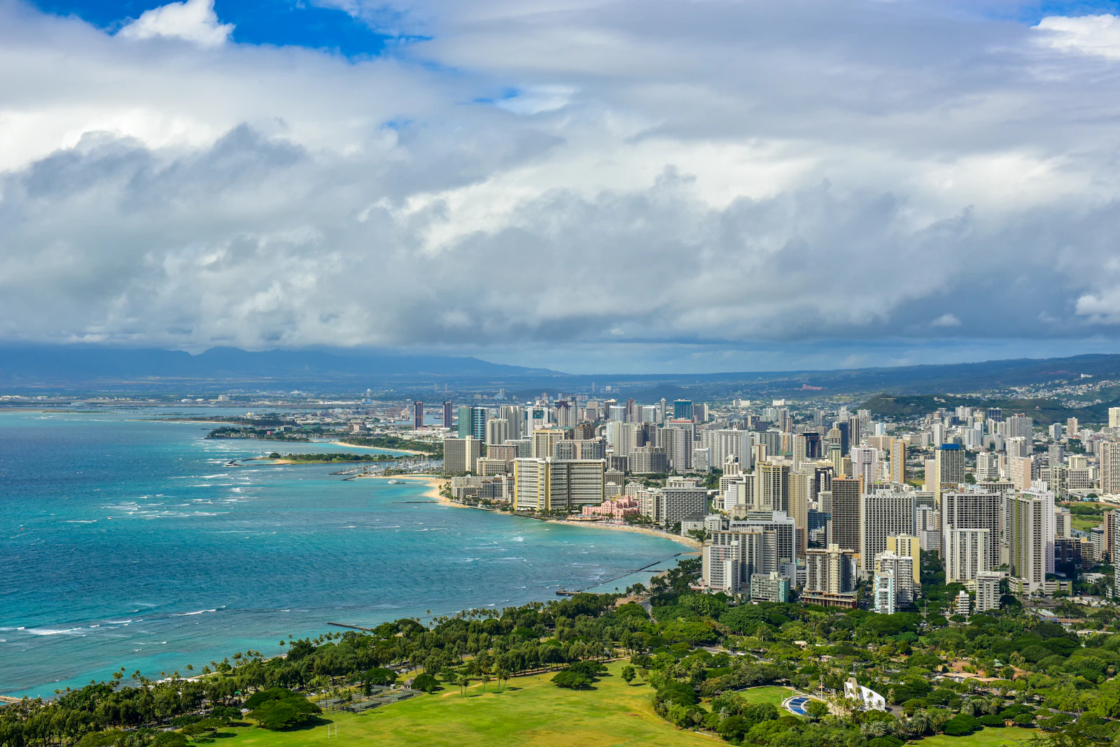 Waikiki and the Honolulu skyline along the shore, seen from Diamond Head on Oahu