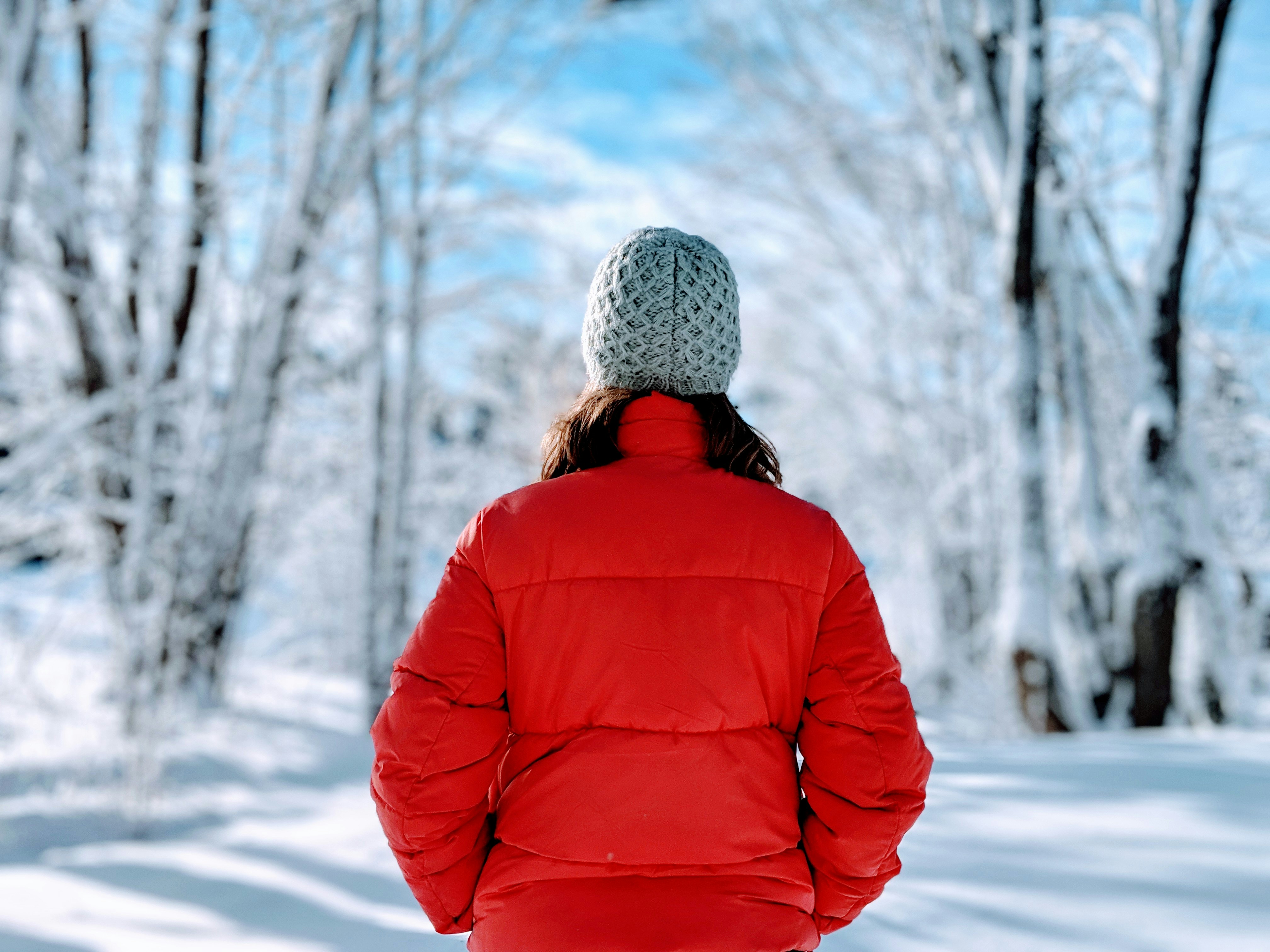 woman wearing red bubble jacket