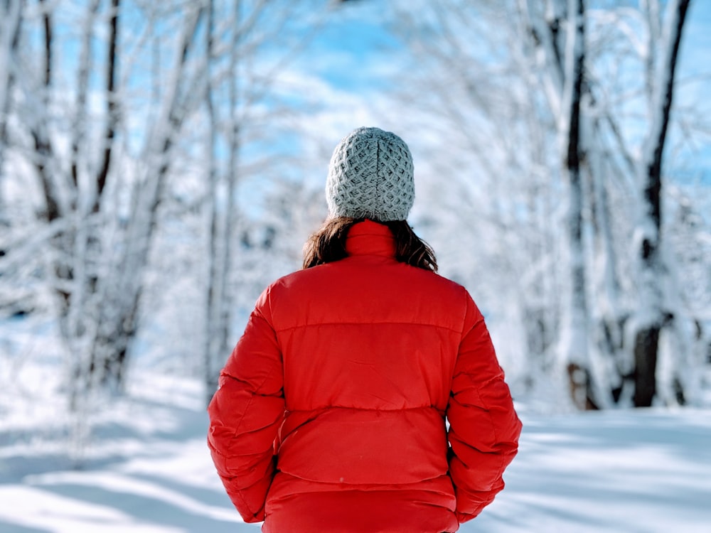 woman wearing red bubble jacket