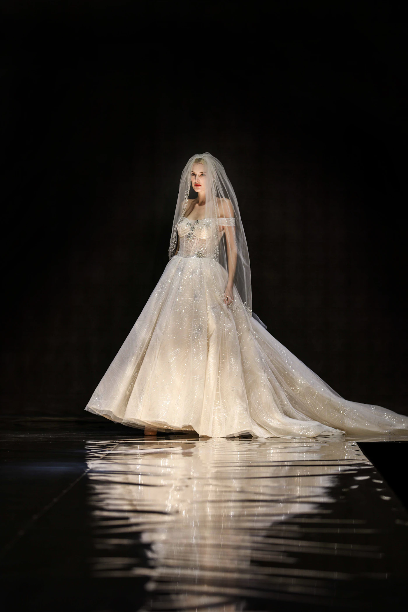 Bridal fashion week trends for fall weddings — A structured bridal gown with oversized bow detail perfect for autumn ceremonies.