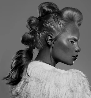 Artistic shot of a braided updo adorned with traditional African accessories