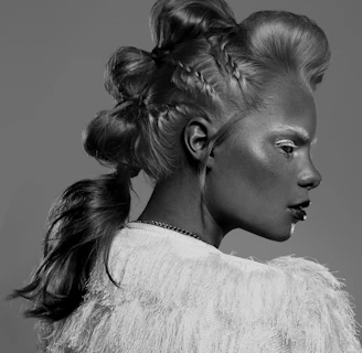 Artistic shot of a braided updo adorned with traditional African accessories