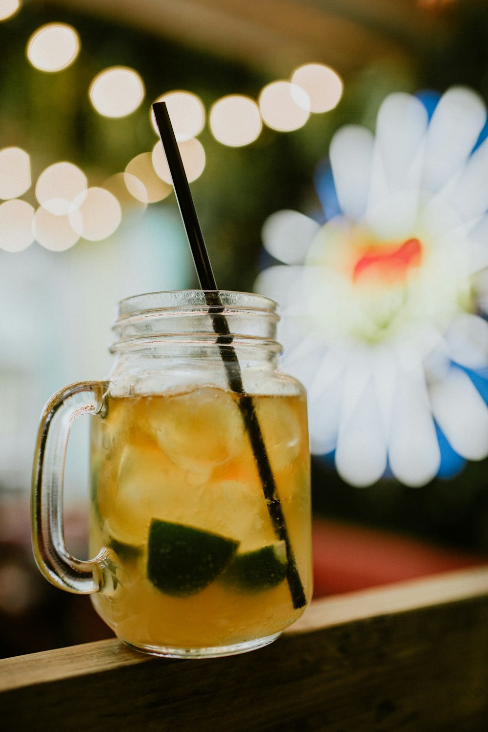 lime drink on mason mug ice and straw