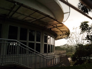 Modern residential architecture harmonizing with natural surroundings at sunset