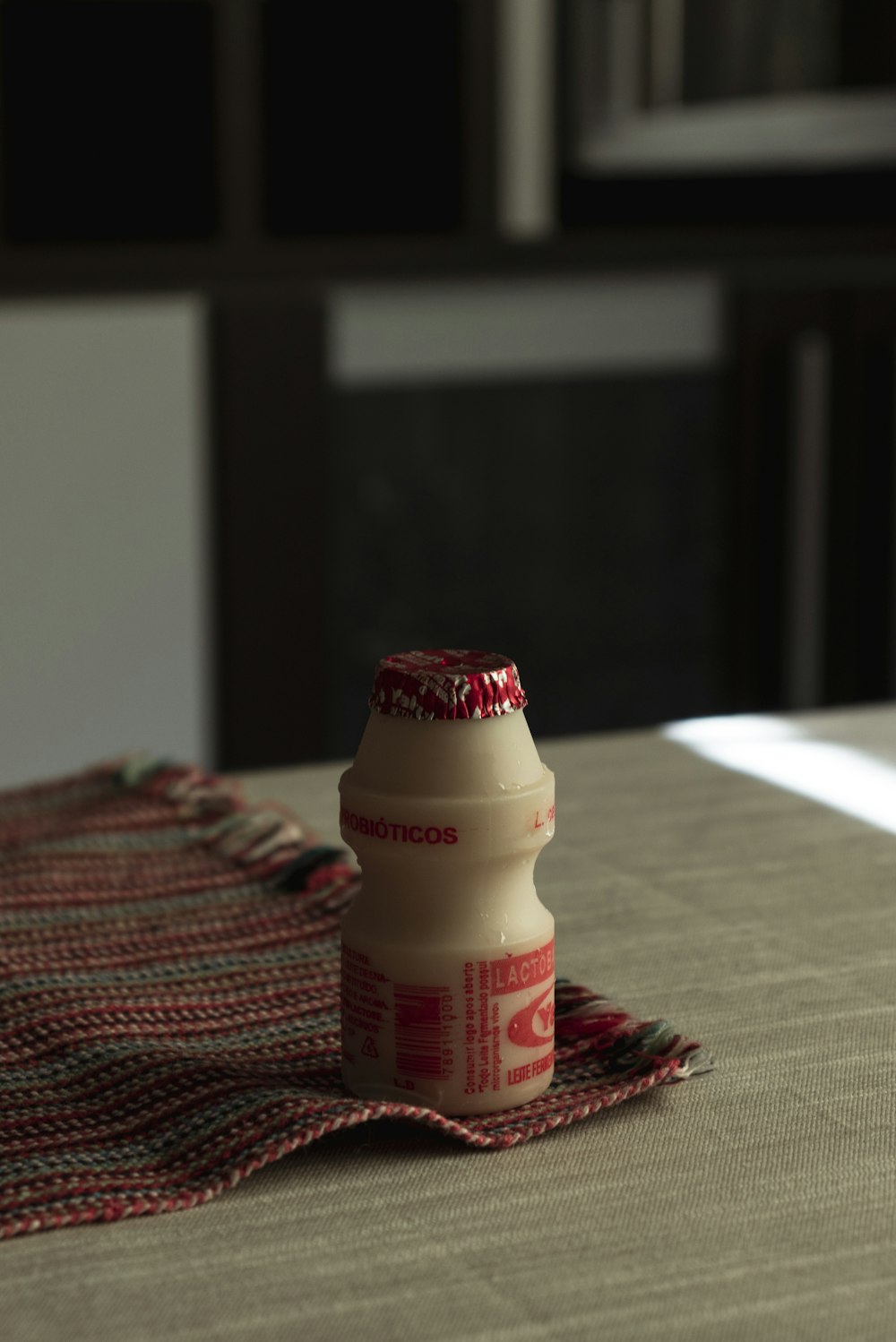 Yakult plastic bottle on table