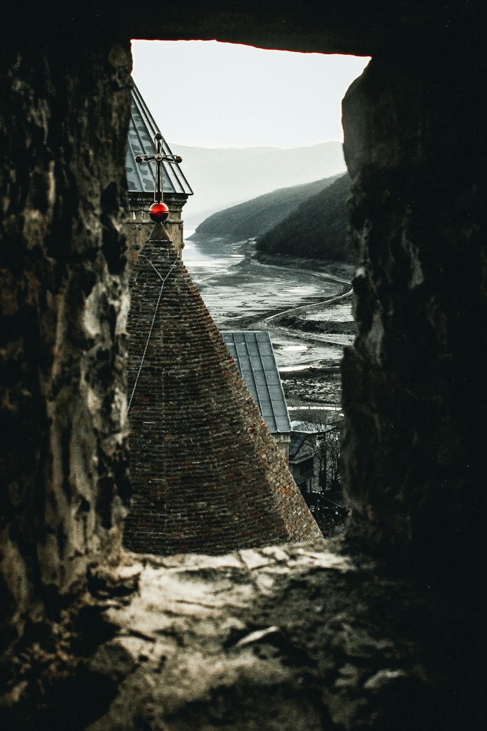 gray chapel near body of water