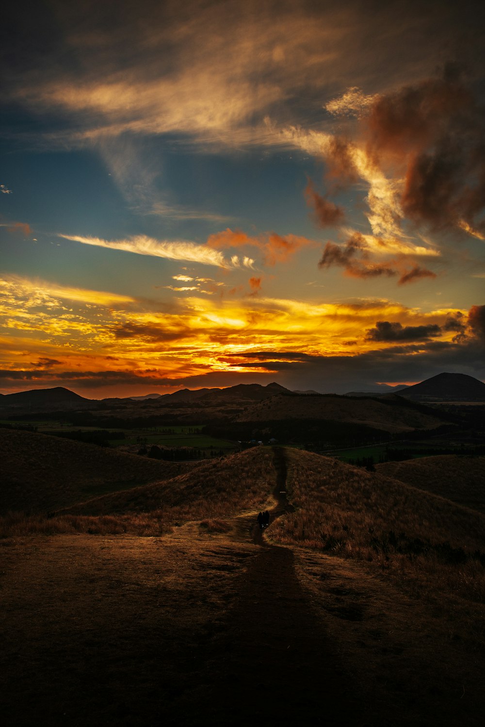 mountain under gray and brown sky