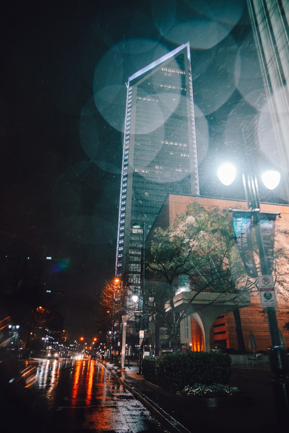 low angle photo of building with bokeh lights