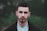 man in black coat in selective focus photo