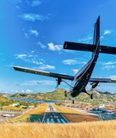 black air plane above brow hays under blue sky
