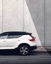 white SUV parked on road