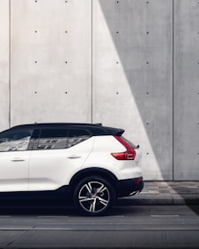 white SUV parked on road