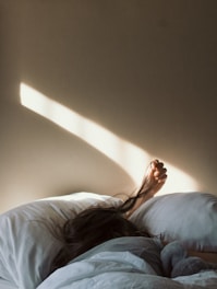 woman lying on bed