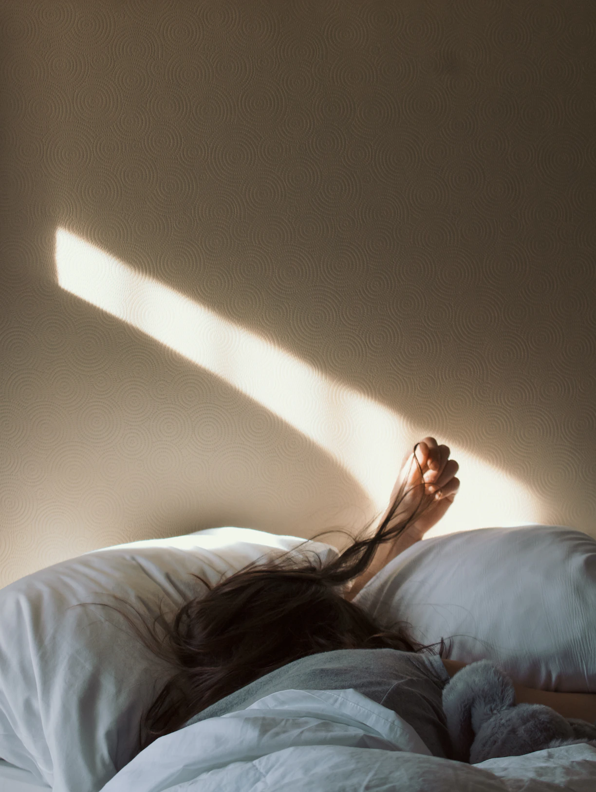 woman lying on bed