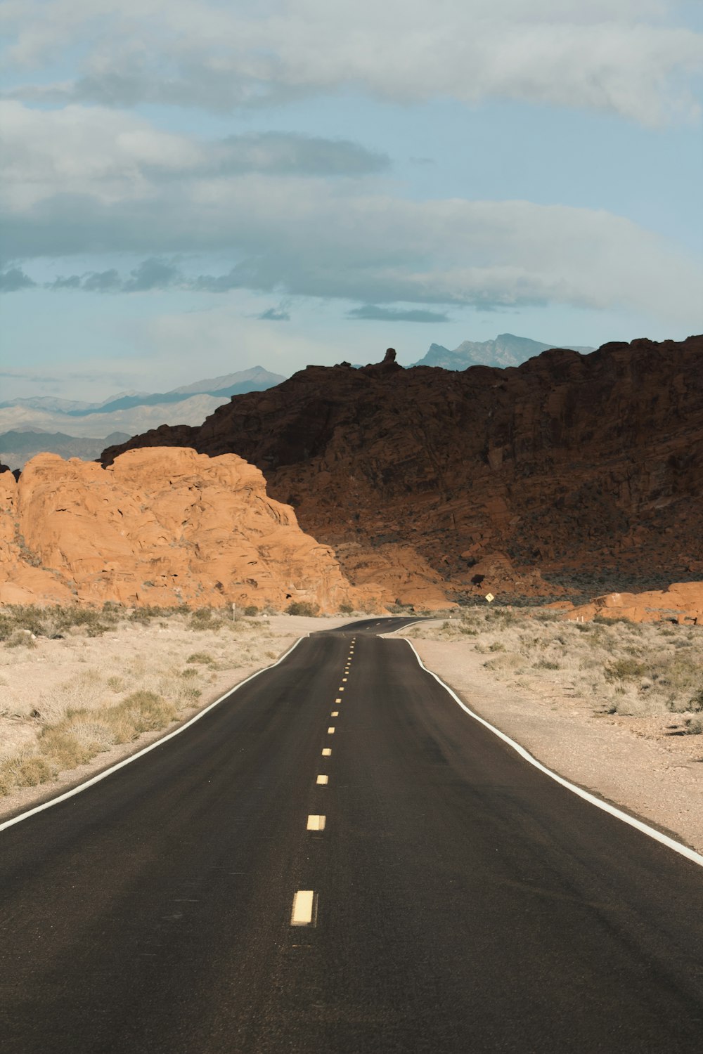 gray road near mountains