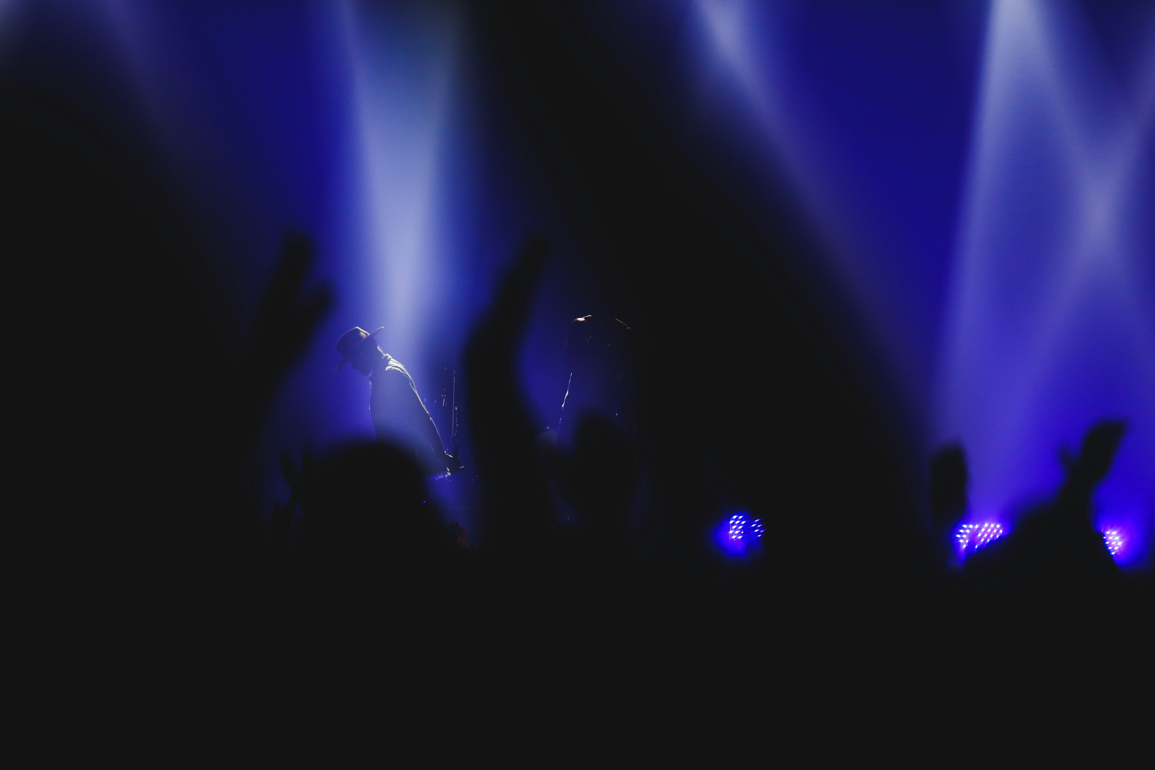 a group of people standing on top of a stage