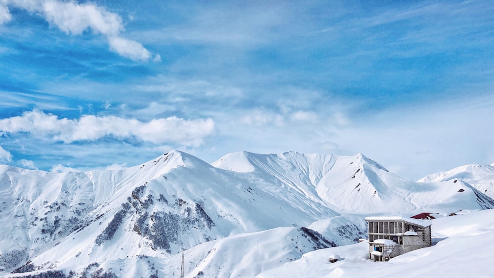 brown house in the middle of snow field