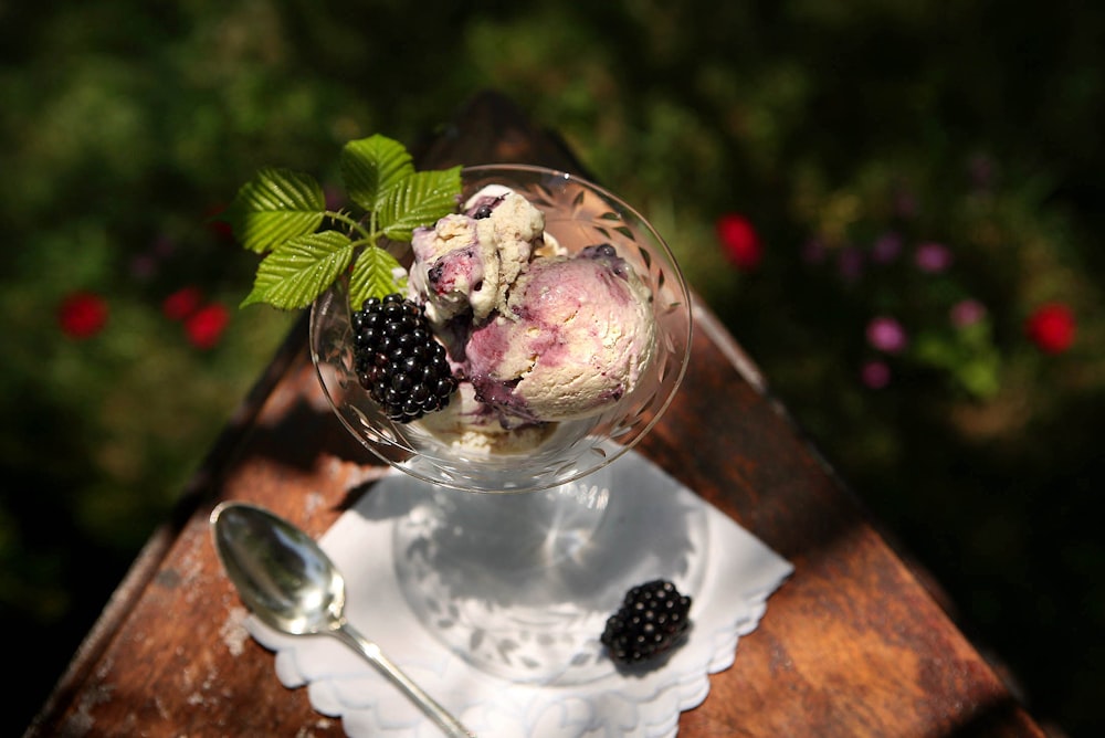 mulberries and ice cream on glass