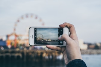 person taking picture Ferris Wheel