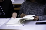 woman flipping book page