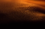 A detailed shot of layered paint textures capturing light and shadow.