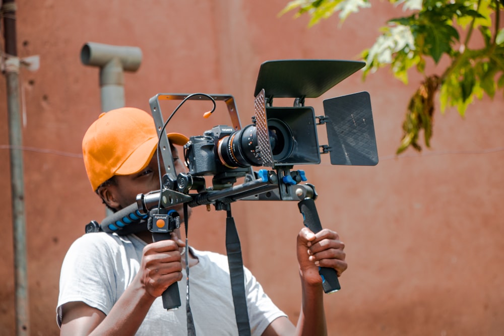 boy holding camera