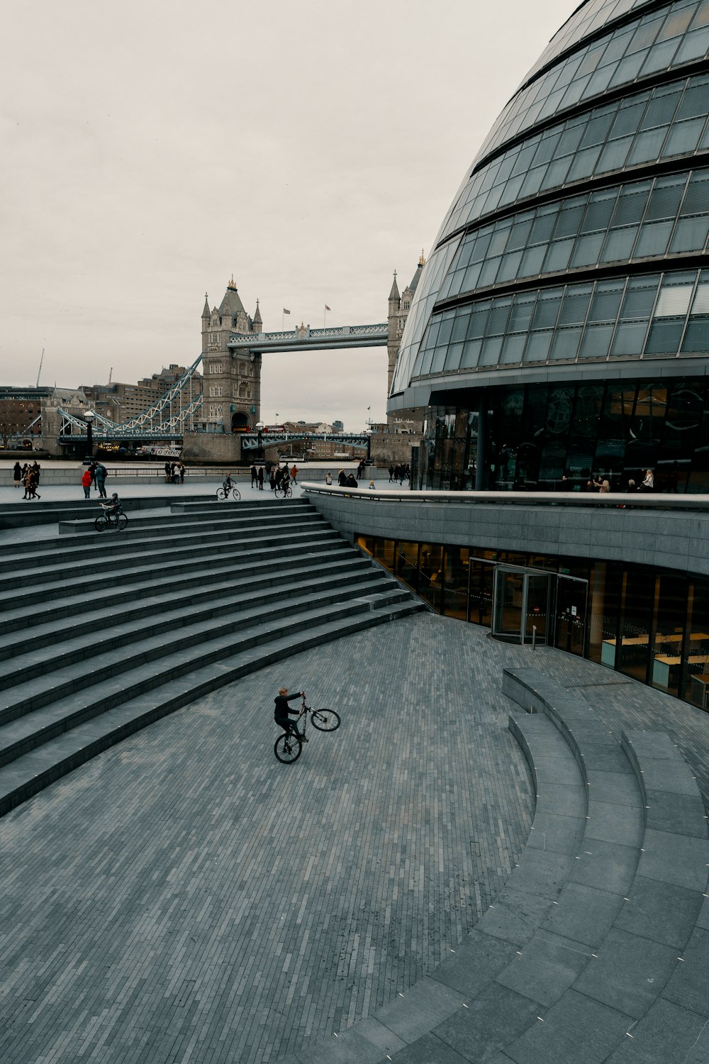 man riding bike near building