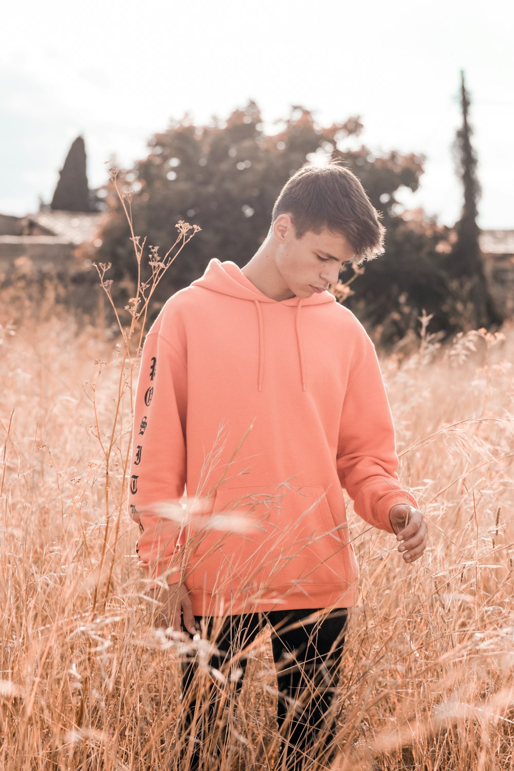 person wearing orange hoodie