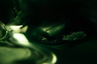 Close-up of a digital artwork with subtle textures and muted green tones.