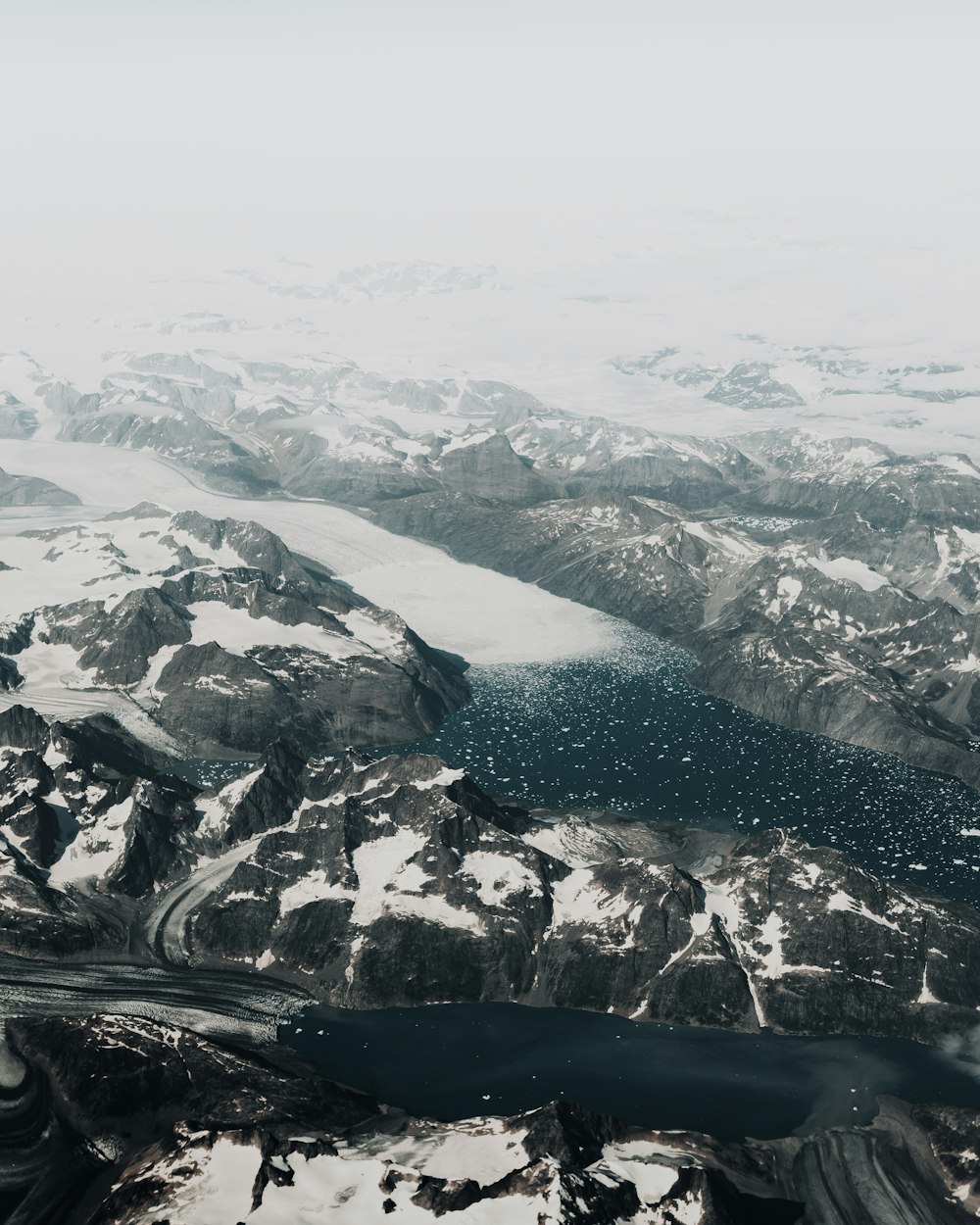 aerial view of mountains covered with snow