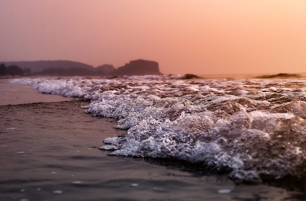 view of seashore during sunset