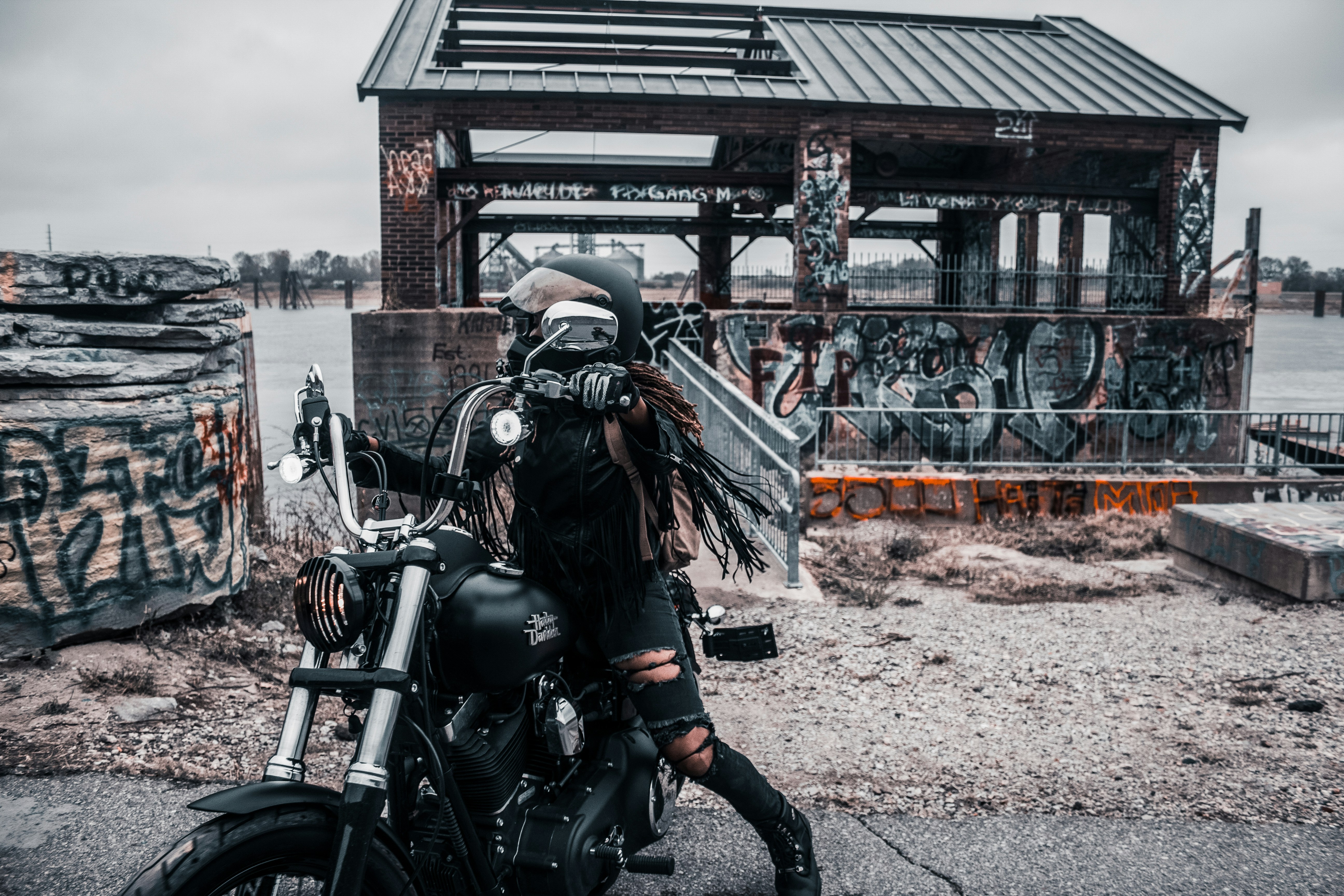 woman riding on cruiser motorcycle during daytime